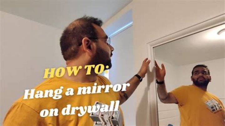How do you hang a sconce on a mirror